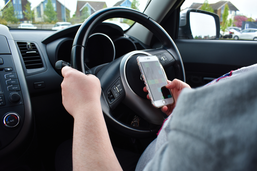 A driver using the phone while driving