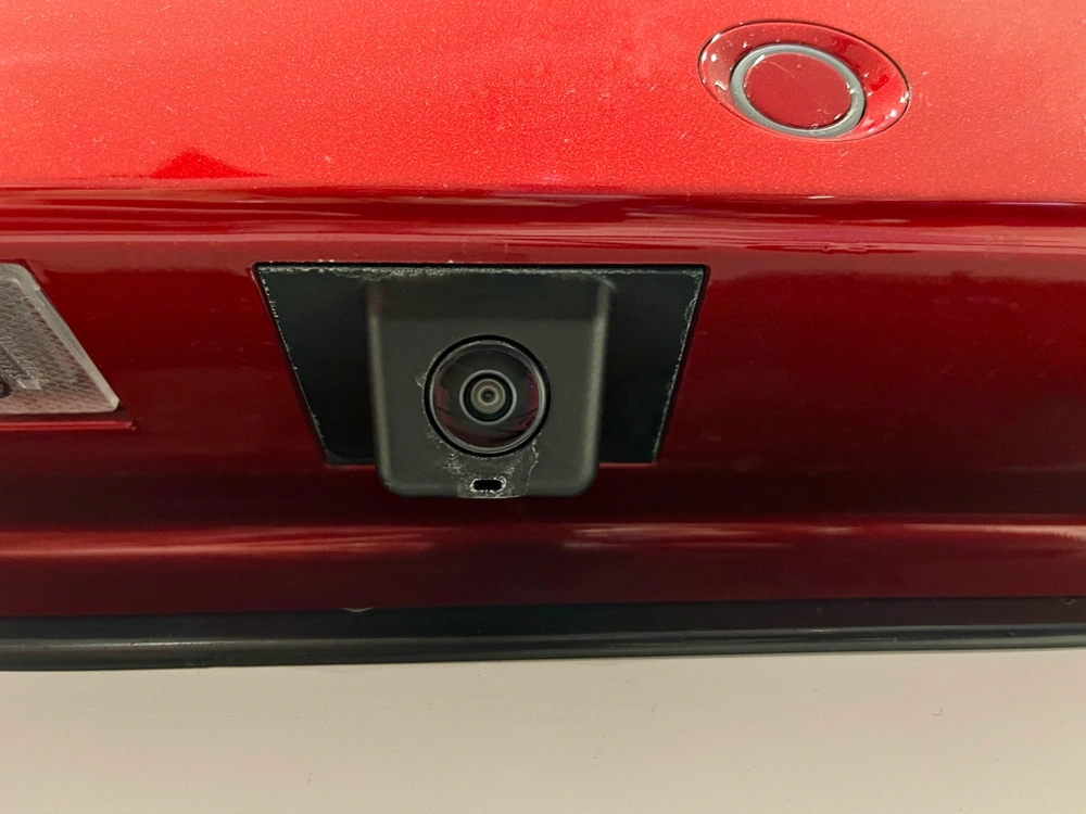 Rear view camera with a washer installed on the car